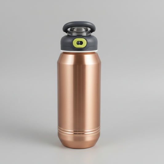 Copper-colored tool or device with a black and green component on a tiled floor background