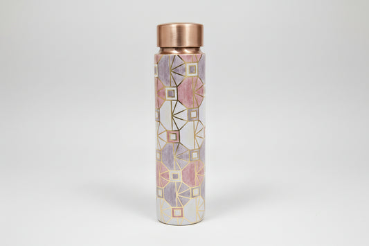 Decorative water bottle with geometric pattern and metallic accents on a tiled background