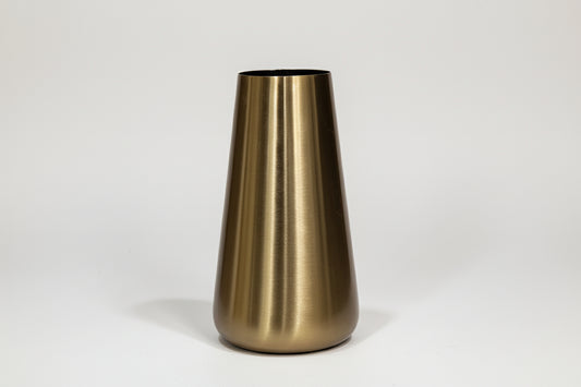 Gold cylindrical object on a marble surface